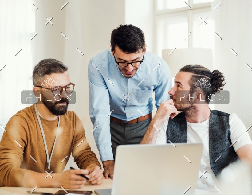 demo-attachment-82-group-of-young-businesspeople-with-laptop-working-8SHTZUN